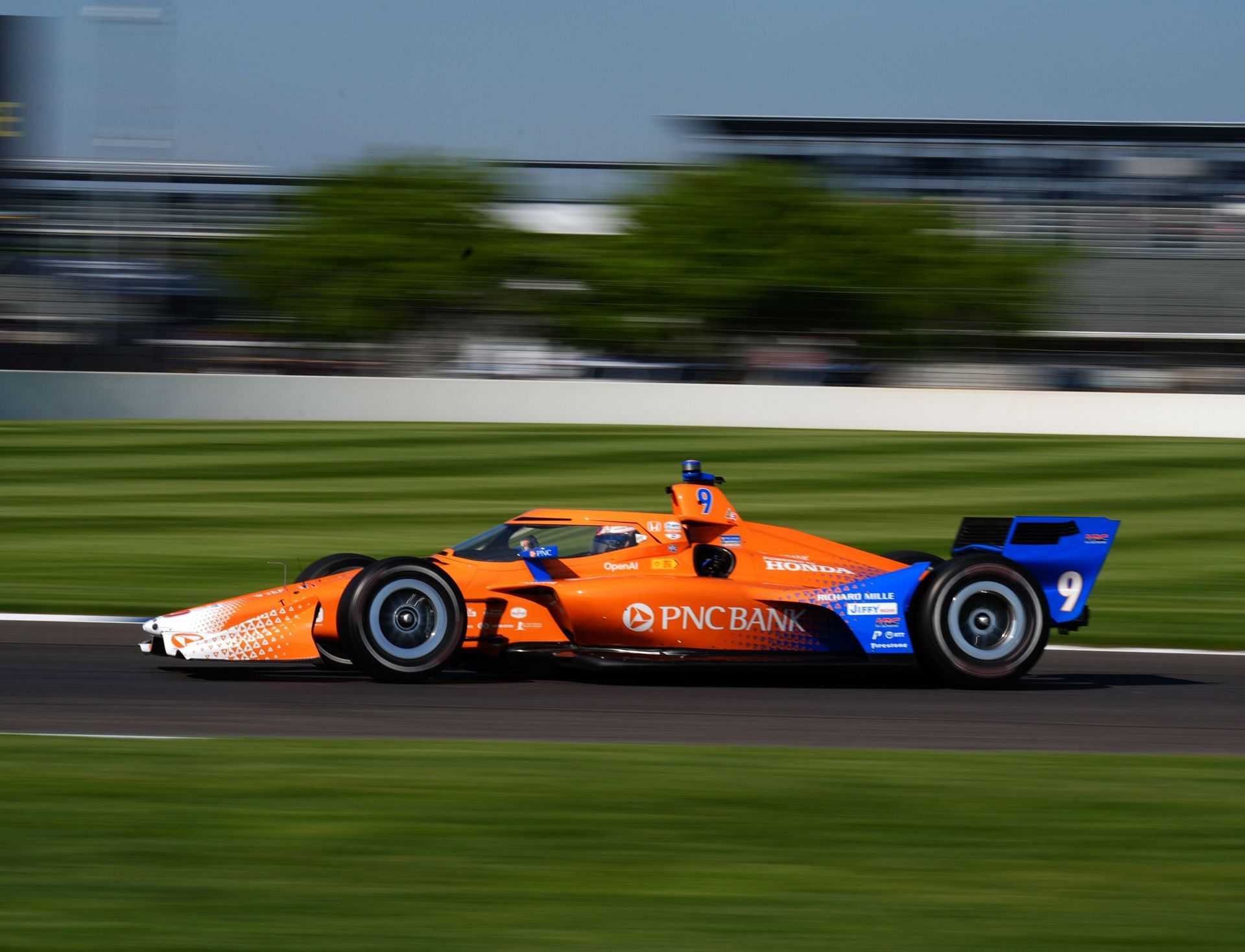 Scott Dixon drives through turn 8 of the Indianapolis Motor Speedway road course during practice for the IndyCar Sonsio Grand Prix - Source: Getty
